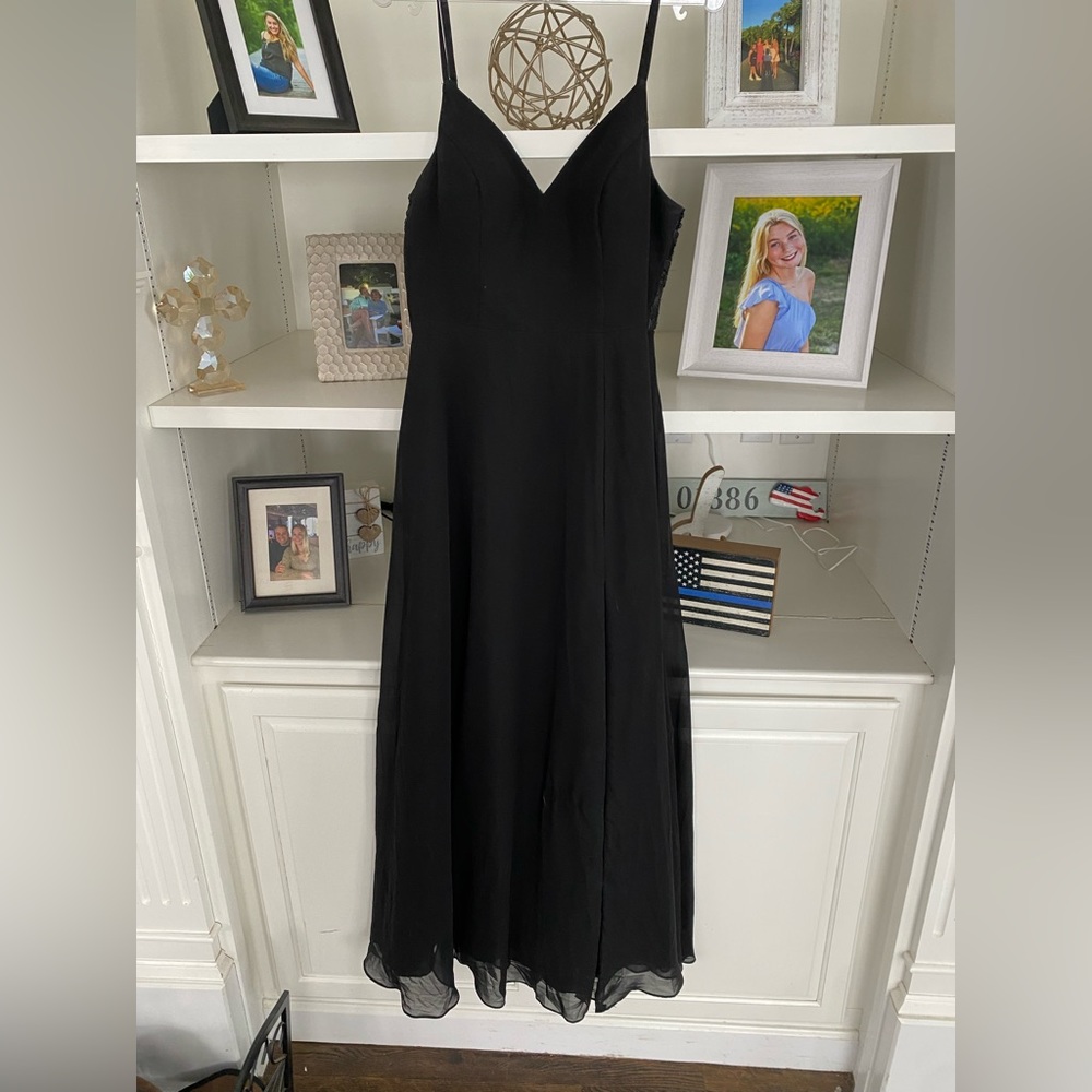 Long black prom dress (tighter up top, flowy with slit on bottom)
